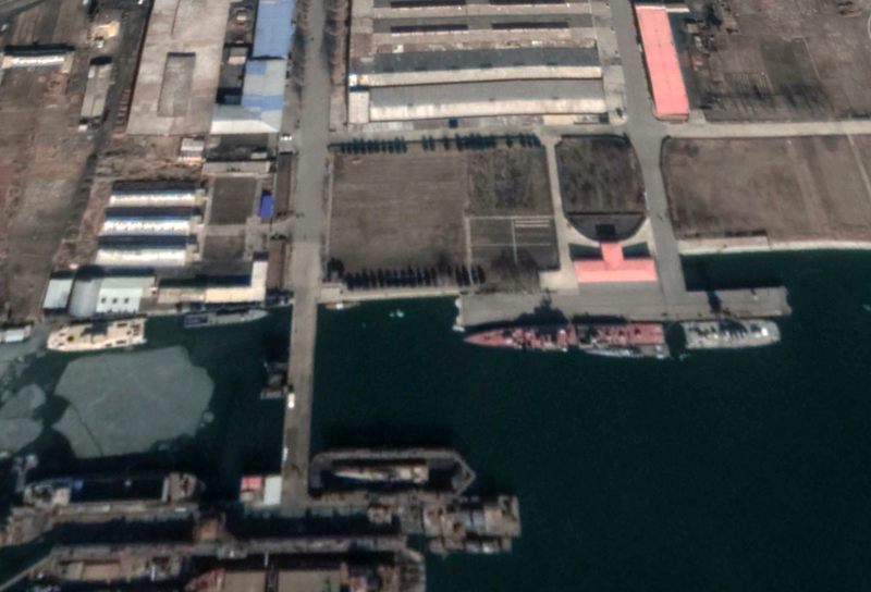 Left to right: KPN hovercraft, mystery ship, Krivak-class frigate, and a second hovercraft. A narrow patrol boat-type warship is tied up next to the Krivak, and a second of the class is in drydock at the bottom of the screenshot.